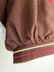 Chaqueta chocolate con flores bordadas - detalle de puño