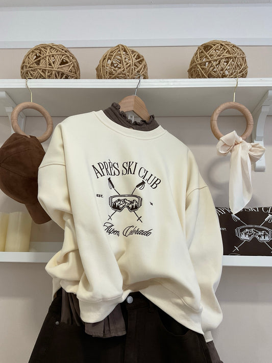 Beige | Sudadera Asper Après Ski Club look con pantalón chocolate